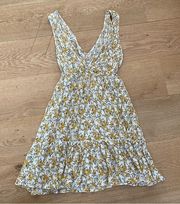 Mahina Surplice Front Sleeveless Tie Waist Mini Dress in Yellow Floral