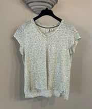 green and white floral top