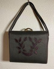 Vintage blackish gray bag fabric exterior with purple embroidered flower pattern