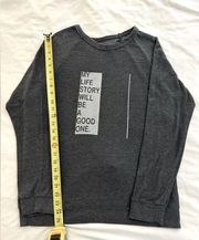 good hYOUman charcoal gray sweatshirt with inspirational text on the front.M