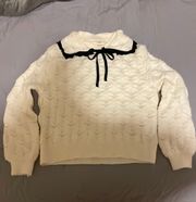 bow front neutral sweater