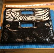 Gap black shiny clutch with zebra print inside