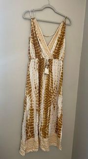 s size medium swim cover in a gold and white pattern