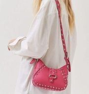 hot pink studded shoulder bag.