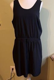 All in motion drawstring waist front pockets curved hem scoop back black dress