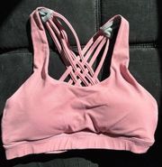 Queenieke size 4/6 sports bra, pink with grey lining criss cross back