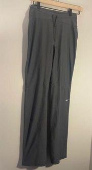 NIKE dri fit black pants with zippers at the bottom ankle and back pockets EUC