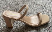 Beige double strap heels