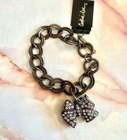 Cookie Lee brass tone pave rhinestone bow bracelet