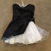 Mini strapless black and white never worn dress