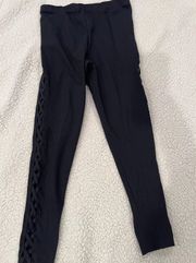 Womens black side cutout Leggings. Brand Ambiance Size Small. Crisscross cutout down side