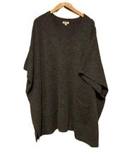 Kori dark gray poncho with pockets size M/L. Has arm holes.