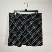 The limited tweed plaid chain embellished skirt