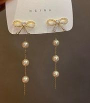 Elegant Bow White Pearl Dangle Drop Earrings for Women 9 New with tags! This delicate pearl drop earrings make for an 