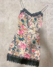 Floral bodycon dress with lace detailing.