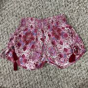 Low Rise Smocked Waist Tassel Galaxy Shorts in Red & White Pattern