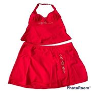 Red 2 piece swimsuit skirt style and top with gold trim