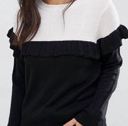 black and white sweater with ruffles
