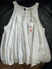 White sleeveless blouse