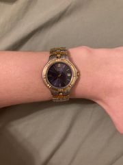 Woman’s dark blue Roman numeral dial two tone stainless   elegance watch