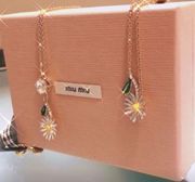 Miu Miu gold and gingham Daisy necklace and bracelet set Prada owned​​​​