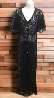 Black Lace Sheer Maxi Dress Size S NWT  This stunning black lace maxi dress from  is perfect for any formal occasion or cocktail party. The V-neckline and short sleeves add a touch of elegance, while the sheer fabric and lace accents create a subtle and sophisticated look. The dress is made of a comfortable cotton blend material that is easy to hand wash and care for.   With a size of S, this dress is perfect for women who want to look and feel their best. The button detailing on the dress adds a stylish touch, and the long dress length creates a captivating silhouette. Whether you're attending a wedding, prom, or any other formal event, this Elan black lace maxi dress is the perfect choice.