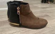 brown and black Chelsea boots