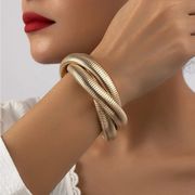 Gold intertwined triple gold cuff bangle — Twist Design