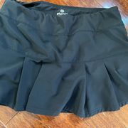 It’s black pleated exercise skirt