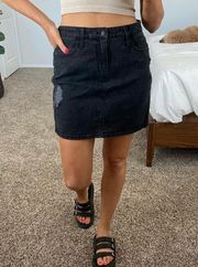 Distressed black denim mini skirt