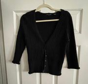 Black sweater with three-quarter inch sleeves