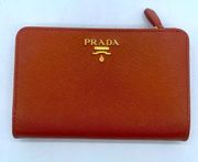 Prada Papaya Orange/ cognac Saffiano leather logo embossed bifold wallet