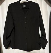 Covington black blouse, two front pockets , adjustable sleeves