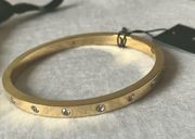 Kate Spade- Crystal (bezel-set) Gold tone hinged/clasp bangle bracelet-dust bag