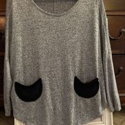 Mod Ref grey knit crew neck with 2 black pockets and batwing sleeves