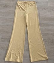 WEWOREWHAT Smocked Flare Pants in yellow