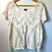 Express embroidered ivory floral top in size large.