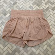 Light pink Altar’d State athletic shorts