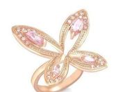 Rose gold flower shaped ring with pink crystals