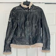 Distressed jacket with faux fur trim and faux leather