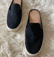 Black canvas slip-on sneakers