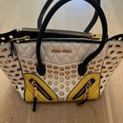 Authentic Miu Miu tote with handles and cross body strap. Yellow, black, white