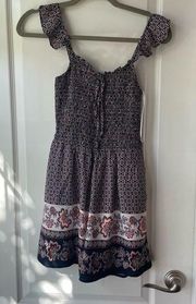 Francesca’s Floral flutter sleeve romper NWOT