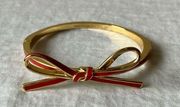 Kate Spade:  3-D RED tied bow Gold tone bracelet/bangle- hinged