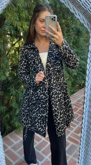 water repellent cheetah trench coat