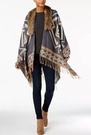 Marcus Adler cape styled in a Southwestern motif and a swish of boho fringe. EUC