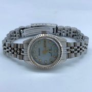 Armitron now 24mm ladies silver tone Quartz analog day date watch up to 7.5” run