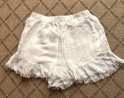 Honey Belle pleated elastic waist white flowy boho shorts w ruffle hem. NWOT S