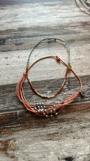 Two burnt orange  bracelets