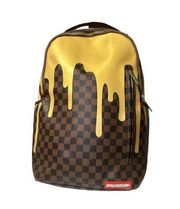 Sprayground gold checkered Drips backpack